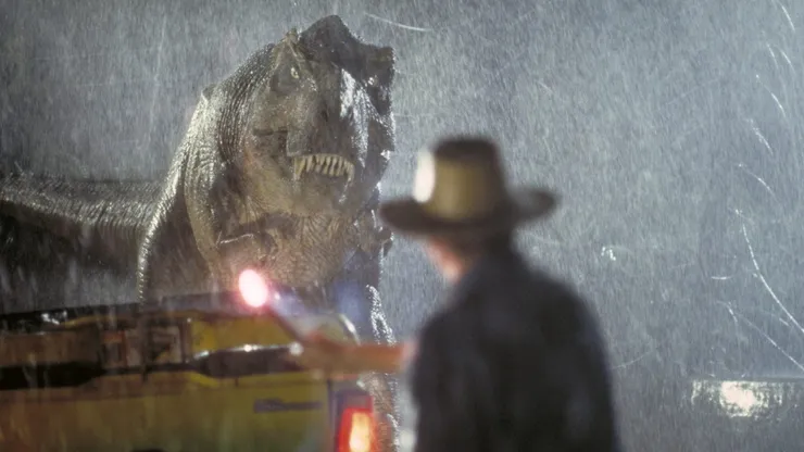 Actor Sam Neill as Dr. Alan Grant takes on a Tyrannosaurus Rex in a scene from the film 'Jurassic Park', 1993. (Photo by Murray Close/Getty Images)