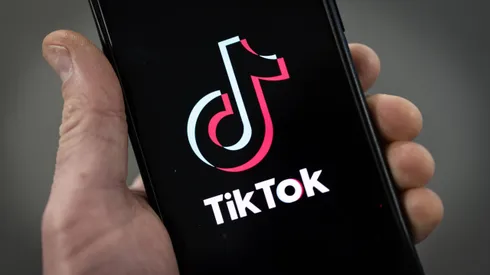 LONDON, ENGLAND - FEBRUARY 28: In this photo illustration, a TikTok logo is displayed on an iPhone on February 28, 2023 in London, England. This week, the US government and European Union's parliament have announced bans on installing the popular social media app on staff devices. (Photo by Dan Kitwood/Getty Images)