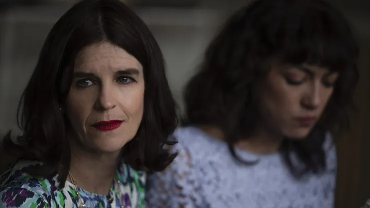 Las Viudas de los Jueves. (L to R) Elena López Fernández as Dorita Ramos, Mayra Hermosillo as Lala de la Luna in Las Viudas de los Jueves. Cr. Camila Jurado / Netflix ©2023