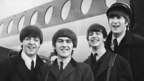 392279 03: FILE PHOTO: The Beatles, left to right, Paul McCartney, George Harrison, Ringo Starr and John Lennon (1940 - 1980) arrive at London Airport February 6, 1964, after a trip to Paris. Conflicting reports were released July 23, 2001 regarding Beatle George Harrison"s battle with cancer. Music producer Sir George Martin was quoted as saying that Harrison expects to die soon from his illnesses. The 58-year-old musician underwent treatment for a brain tumor at a clinic in Switzerland, and had surgery earlier this year for lung cancer. (Photo by Getty Images)