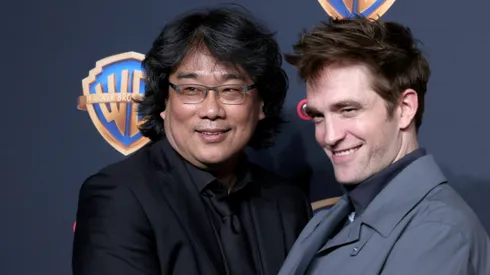LAS VEGAS, NEVADA - APRIL 09: (L-R) Bong Joon-ho and Robert Pattinson attend the Warner Bros. Pictures Presentation during CinemaCon 2024 at The Colosseum at Caesars Palace on April 09, 2024 in Las Vegas, Nevada. (Photo by Gabe Ginsberg/Getty Images)