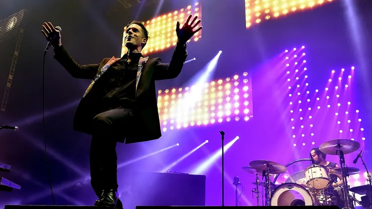 LAS VEGAS, NEVADA - APRIL 06: Musicians Brandon Flowers (L) and Ronnie Vannucci, Jr. of The Killers perform onstage during the grand opening of T-Mobile Arena on April 6, 2016 in Las Vegas, Nevada. (Photo by Kevin Winter/Getty Images for ABA)