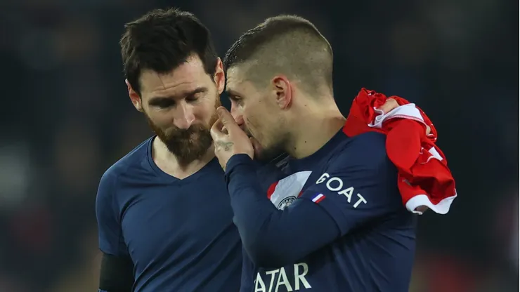 PARIS, FRANCE - FEBRUARY 14: Lionel Messi and Marco Verratti of Paris Saint-Germain talk after the UEFA Champions League round of 16 leg one match between Paris Saint-Germain and FC Bayern München at Parc des Princes on February 14, 2023 in Paris, France. (Photo by Alex Grimm/Getty Images)