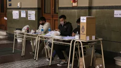 BUENOS AIRES, ARGENTINA, SEPTEMBER 12: Polling station authorities wait for citizens to cast their vote during midterm primary elections on September 12, 2021 in Buenos Aires, Argentina. With health protocols and restrictions to prevent contagion Argentinians are heading to polls amid the COVID-19 pandemic. (Photo by Ricardo Ceppi / Getty Images)