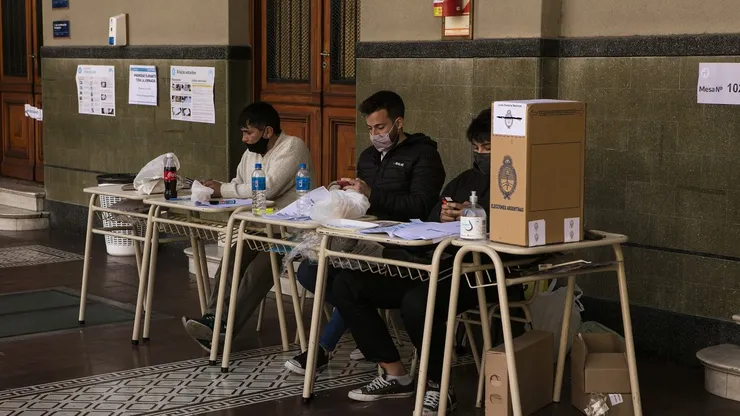 BUENOS AIRES, ARGENTINA, SEPTEMBER 12: Polling station authorities wait for citizens to cast their vote during midterm primary elections on September 12, 2021 in Buenos Aires, Argentina. With health protocols and restrictions to prevent contagion Argentinians are heading to polls amid the COVID-19 pandemic. (Photo by Ricardo Ceppi / Getty Images)