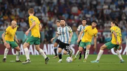 DOHA, QATAR - DECEMBER 03: Lionel Messi of Argentina tracked by Aaron Mooy (l) Mathew Leckie (2r) and Jackson Irvine (r) of Australia during the FIFA World Cup Qatar 2022 Round of 16 match between Argentina and Australia at Ahmad Bin Ali Stadium on December 03, 2022 in Doha, Qatar. (Photo by Michael Steele/Getty Images)