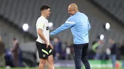 ISTANBUL, TURKEY - JUNE 09: Pep Guardiola, Manager of Manchester City, talks to Julian Alvarez of Manchester City during the Manchester City Training Session ahead of the UEFA Champions League 2022/23 final on June 09, 2023 in Istanbul, Turkey. (Photo by Catherine Ivill/Getty Images)