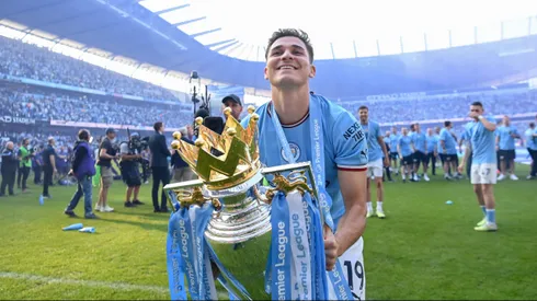 MANCHESTER, ENGLAND - MAY 21: Julian Alvarez of Manchester City celebrates with the Premier League trophy following the Premier League match between Manchester City and Chelsea FC at Etihad Stadium on May 21, 2023 in Manchester, England. (Photo by Michael Regan/Getty Images)