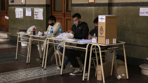 BUENOS AIRES, ARGENTINA, SEPTEMBER 12: Polling station authorities wait for citizens to cast their vote during midterm primary elections on September 12, 2021 in Buenos Aires, Argentina. With health protocols and restrictions to prevent contagion Argentinians are heading to polls amid the COVID-19 pandemic. (Photo by Ricardo Ceppi / Getty Images)