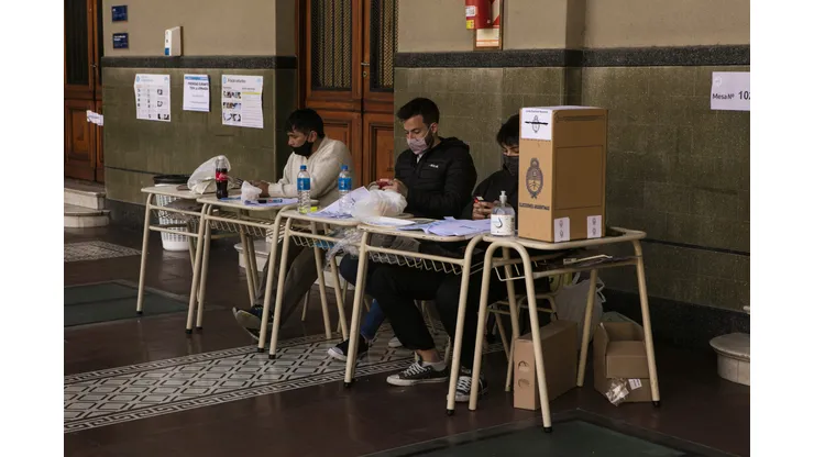BUENOS AIRES, ARGENTINA, SEPTEMBER 12: Polling station authorities wait for citizens to cast their vote during midterm primary elections on September 12, 2021 in Buenos Aires, Argentina. With health protocols and restrictions to prevent contagion Argentinians are heading to polls amid the COVID-19 pandemic. (Photo by Ricardo Ceppi / Getty Images)