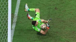 LUSAIL CITY, QATAR - DECEMBER 18: Emiliano Martinez of Argentina saves the second penalty from Kingsley Coman of France in the penalty shoot out during the FIFA World Cup Qatar 2022 Final match between Argentina and France at Lusail Stadium on December 18, 2022 in Lusail City, Qatar. (Photo by Buda Mendes/Getty Images)
