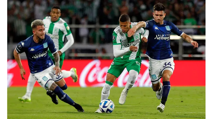Atletico Nacional's midfielder Nelson Deossa (C) fights for the ball with Racing's defender Gonzalo Piovi (L) and defender Facundo Mura during the Copa Libertadores round of 16 first leg football match between Colombia's Atletico Nacional and Argentina's Racing Club at the Atanasio Girardot stadium in Medellin, Colombia, on August 3, 2023. (Photo by Fredy BUILES / AFP) (Photo by FREDY BUILES/AFP via Getty Images)