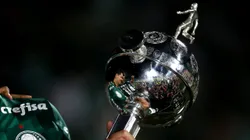 MONTEVIDEO, URUGUAY - NOVEMBER 27: Detail of Copa Libertadores trophy as players of Palmeiras celebrate after the final match of Copa CONMEBOL Libertadores 2021 between Palmeiras and Flamengo at Centenario Stadium on November 27, 2021 in Montevideo, Uruguay. Palmeiras defeated Flamengo by 2-1 in extra time. (Photo by Ernesto Ryan/Getty Images)