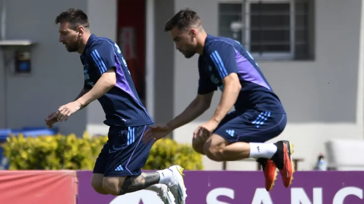 EZEIZA, ARGENTINA - OCTOBER 16: Lionel Messi and Nicolás Tagliafico of Argentina jump during a training session ahead of the Qualifiers match against Peru at Lionel Messi Training Camp on October 16, 2023 in Ezeiza, Argentina. (Photo by Gustavo Garello/Getty Images)