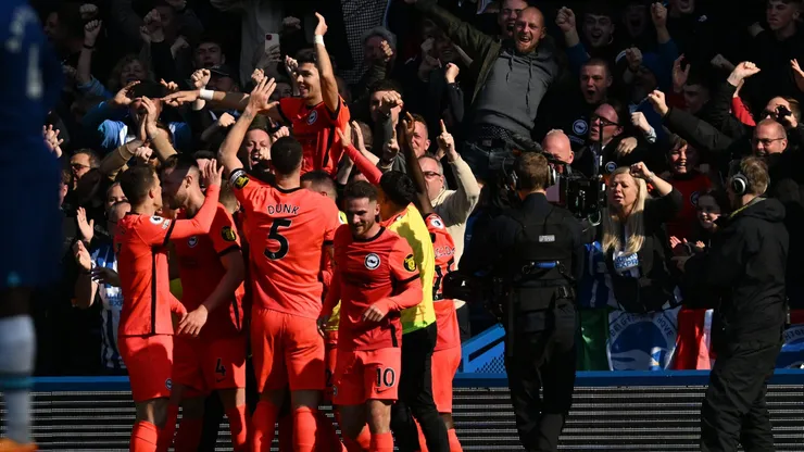 LONDON, ENGLAND - APRIL 15: Julio Enciso of Brighton & Hove Albion celebrates with teammates after scoring the team's second goal during the Premier League match between Chelsea FC and Brighton & Hove Albion at Stamford Bridge on April 15, 2023 in London, England. (Photo by Mike Hewitt/Getty Images)