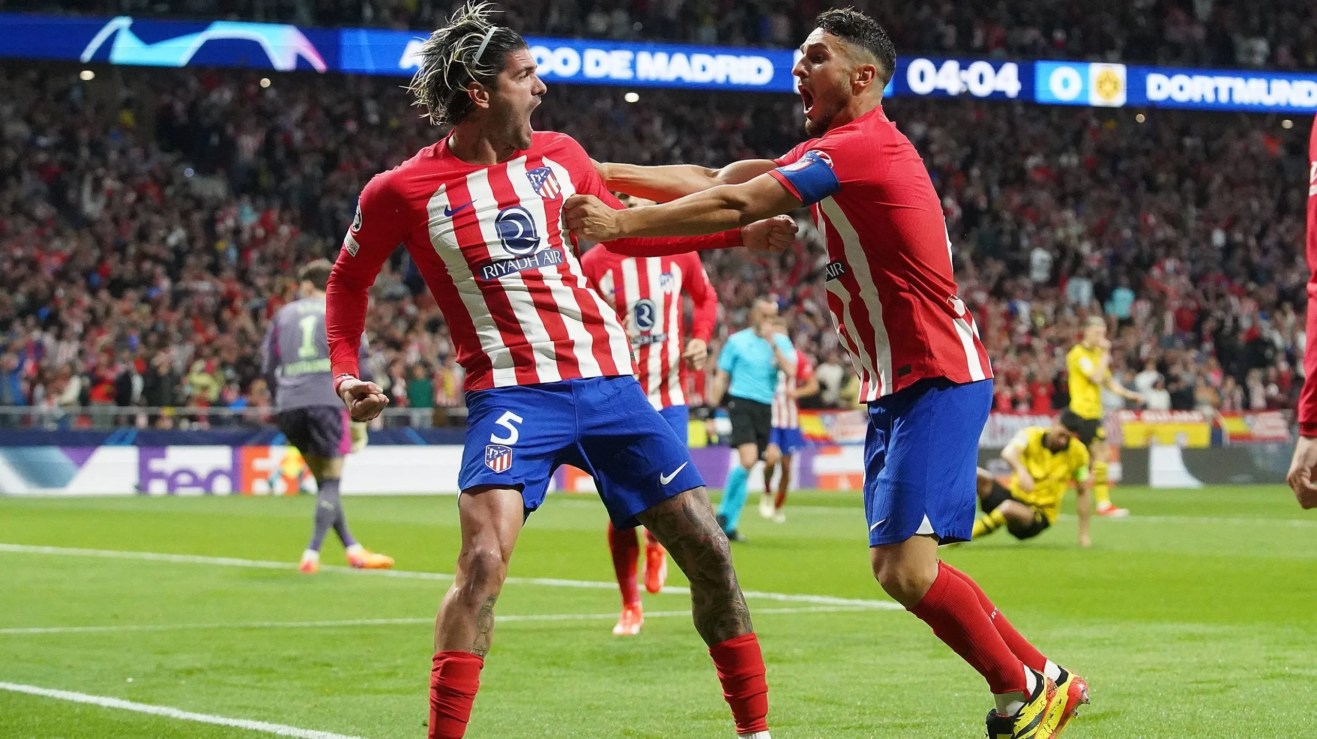 Koke junto a Rodrigo De Paul.