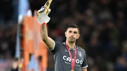 BIRMINGHAM, ENGLAND - JANUARY 04: Emiliano Martinez of Aston Villa holds his adidas FIFA World Cup Golden Glove trophy while wearing his FIFA World Cup winners medal prior to the Premier League match between Aston Villa and Wolverhampton Wanderers at Villa Park on January 04, 2023 in Birmingham, England. (Photo by Dan Mullan/Getty Images)