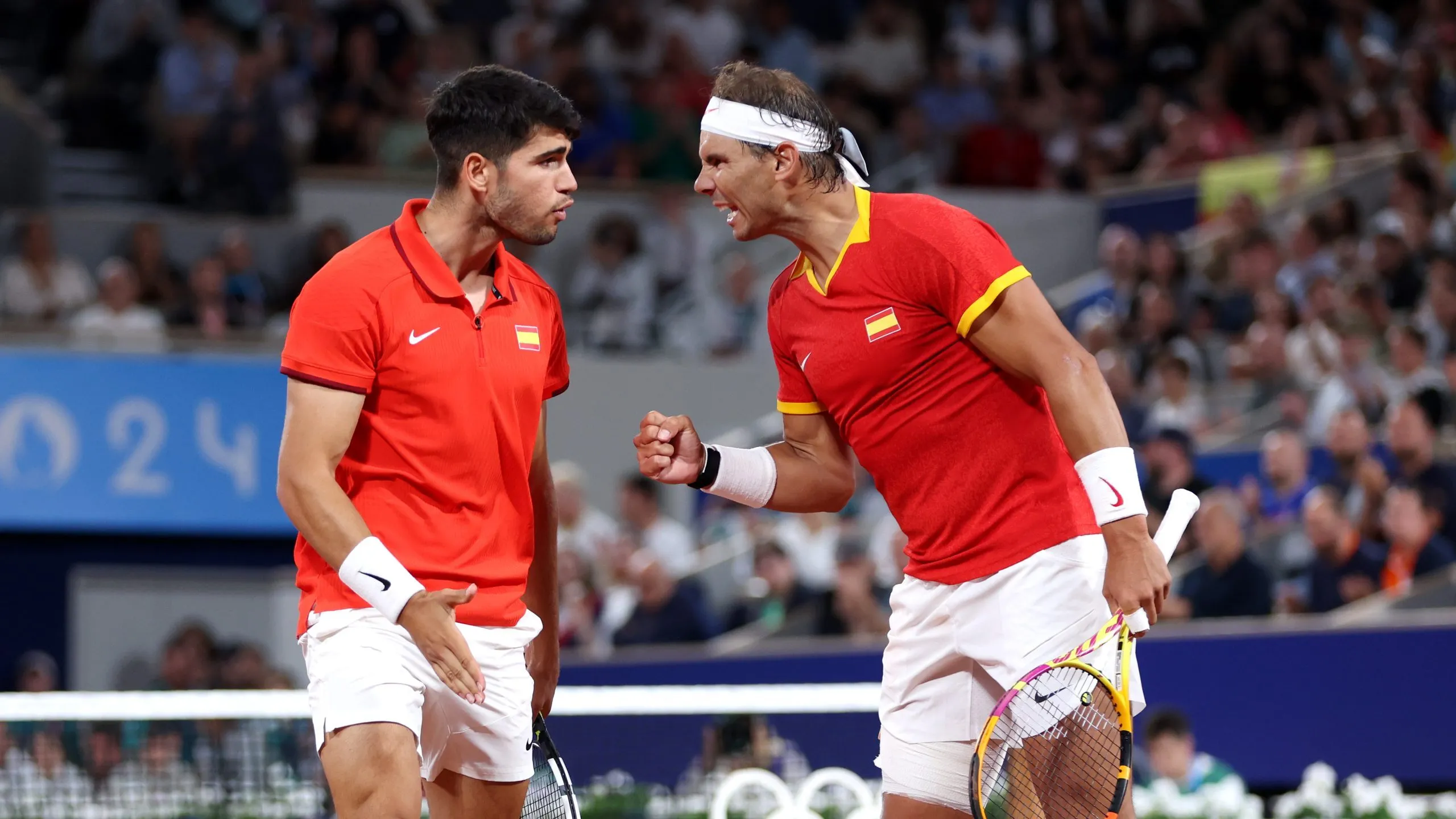 PARIS, FRANCE – JULY 27: Rafael Nadal (R) and partner Carlos Alcaraz of Team Spain celebrate against Andres Molteni and Maximo Gonzalez of Team Argentina during the Men’s Doubles first round match on day one of the Olympic Games Paris 2024 at Roland Garros on July 27, 2024 in Paris, France. (Photo by Clive Brunskill/Getty Images)