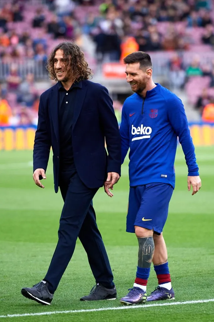 Carles Puyol junto a Lionel Messi. (Getty Images)