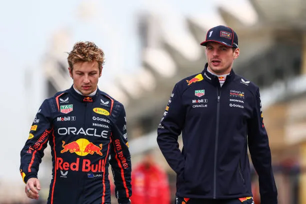 BAHRAIN, BAHRAIN – FEBRUARY 26: Liam Lawson of New Zealand and Oracle Red Bull Racing and Max Verstappen of the Netherlands and Oracle Red Bull Racing walk in the Pitlane during day one of F1 Testing at Bahrain International Circuit on February 26, 2025 in Bahrain, Bahrain. (Photo by Clive Rose/Getty Images)