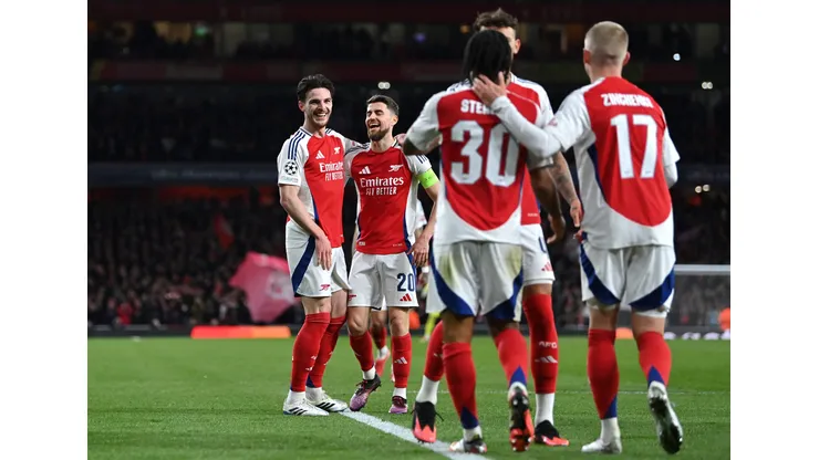 LONDON, ENGLAND - MARCH 12: Declan Rice of Arsenal celebrates scoring his team's second goal with teammate Jorginho and teammates during the UEFA Champions League 2024/25 Round of 16 Second Leg match between Arsenal FC and PSV at Arsenal Stadium on March 12, 2025 in London, England. (Photo by Justin Setterfield/Getty Images)