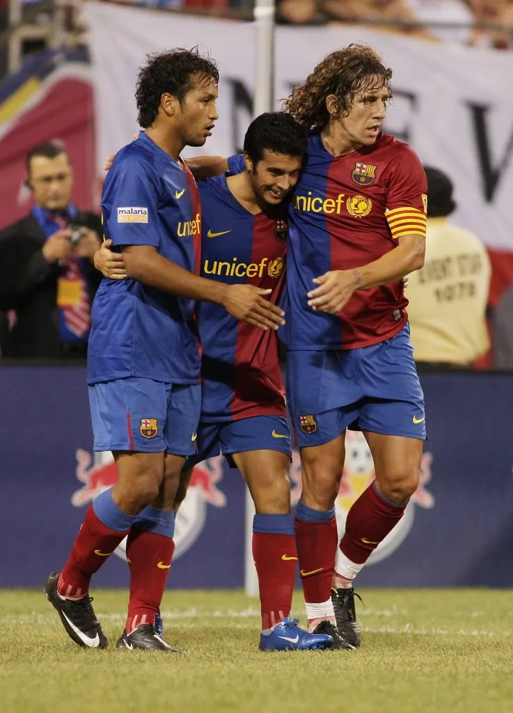 Jeffren junto a Carles Puyol y Pedro Rodríguez.