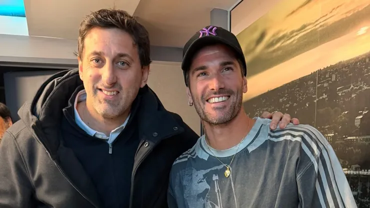 Diego Milito y Rodrigo De Paul, en la cancha de Racing.