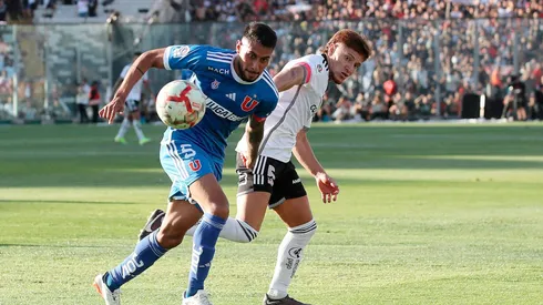 Emmanuel Ojeda disputando un balón con Leonardo Gil, su nuevo compañero en Huracán.