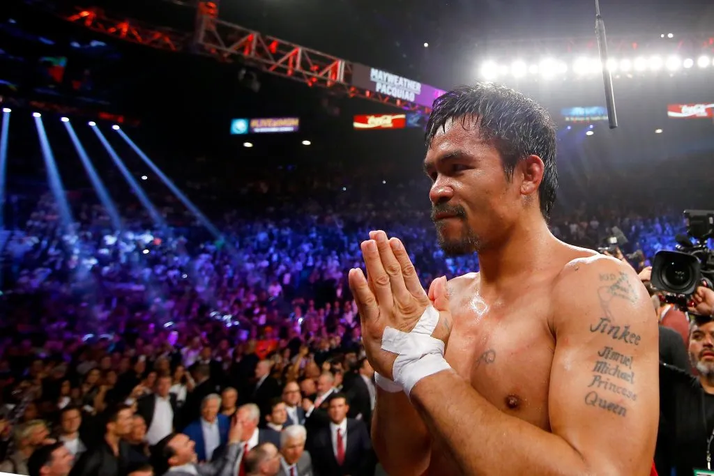 LAS VEGAS, NV – MAY 02:  Manny Pacquiao gestures to the crowd after losing to Floyd Mayweather Jr. in their welterweight unification championship bout on May 2, 2015 at MGM Grand Garden Arena in Las Vegas, Nevada.  (Photo by Al Bello/Getty Images)