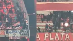 Impactante imagen de un hincha de la U lanzando una bomba de estruendo