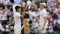 LONDON, ENGLAND - JULY 13: Jannik Sinner of Italy meets Carlos Alcaraz of Spain at the net following victory during the Gentlemen's Singles Final on day fourteen of The Championships Wimbledon 2025 at All England Lawn Tennis and Croquet Club on July 13, 2025 in London, England. (Photo by Julian Finney/Getty Images)