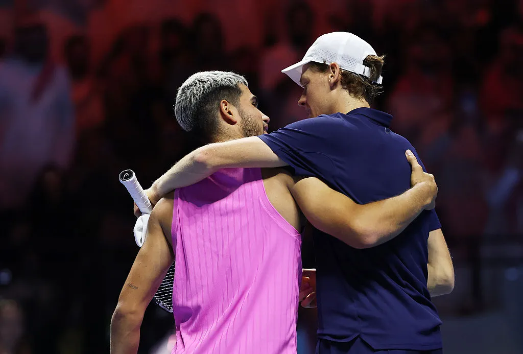 RIYADH, SAUDI ARABIA – OCTOBER 18: Jannik Sinner of Italy and Carlos Alcaraz of Spain embrace after the Men’s Single’s Final on day three of the Six Kings Slam 2025 at ANB Arena on October 18, 2025 in Riyadh, Saudi Arabia. (Photo by Clive Brunskill/Getty Images)