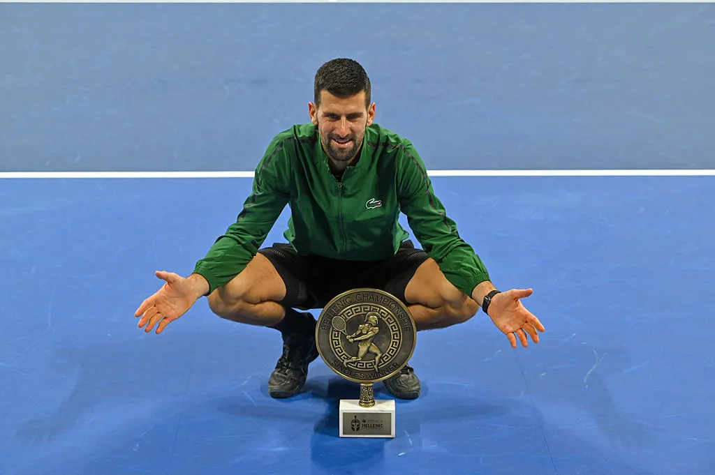 PIRAEUS, GREECE – NOVEMBER 8:Novak Djokovic of Serbia holds the trophy after winning the final match against Lorenzo Musetti of Italy during Hellenic Championship ATP 250 final tennis match, at OAKA Olympic Athletic Center in Athens, Greece, on November 8, 2025 in Piraeus, Greece. (Photo by Milos Bicanski/Getty Images)