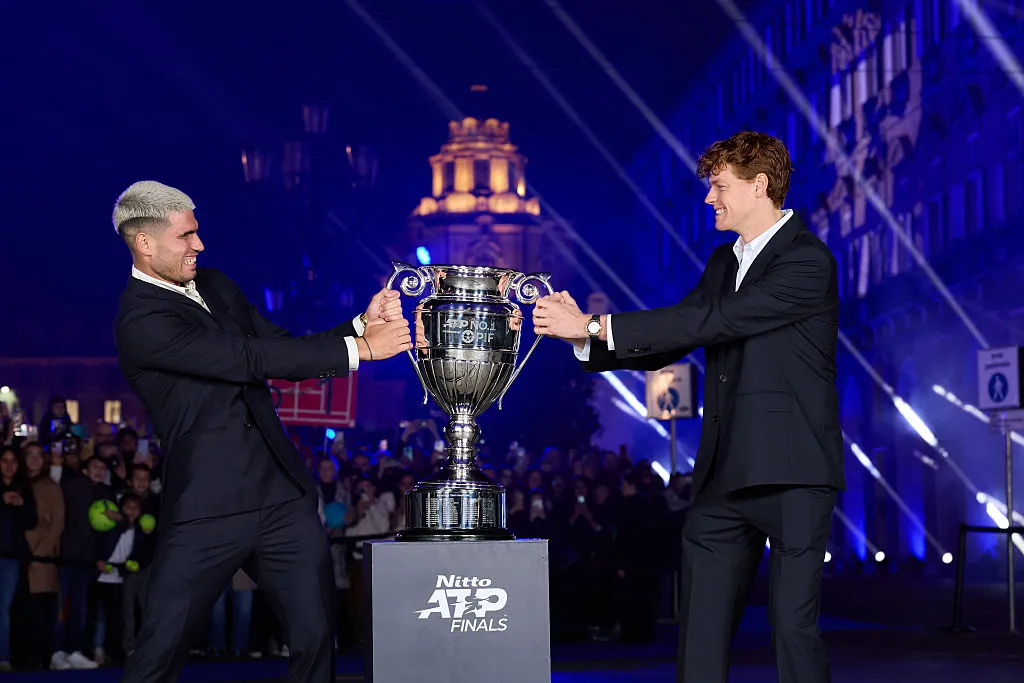 TURIN, ITALY – NOVEMBER 07: L-R  Carlos Alcaraz of Spain and Jannik Sinner of Italy wrestle with the ATP World No.1 Trophy outside the Teatro Regio Torino prior to the Nitto ATP Finals on November 07, 2025 in Turin, Italy. (Photo by Clive Brunskill/Getty Images)