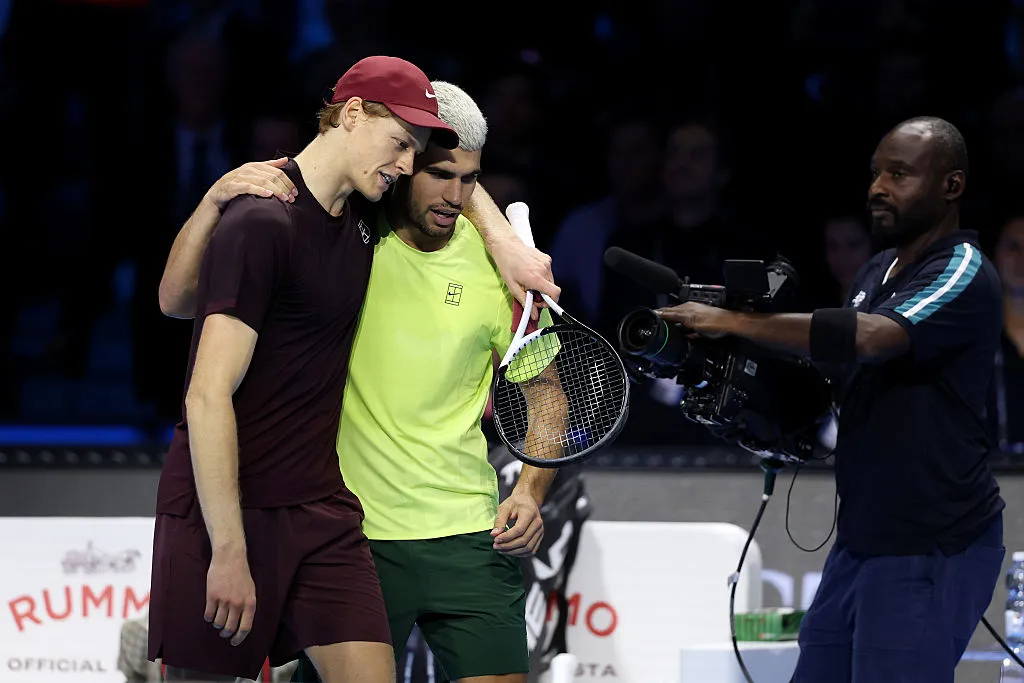 TURIN, ITALY – NOVEMBER 16:  Jannik Sinner of Italy hugs Carlos Alcaraz of Spain following the Men’s Singles Final on day eight of the Nitto ATP Finals 2025 at Inalpi Arena on November 16, 2025 in Turin, Italy. (Photo by Clive Brunskill/Getty Images)