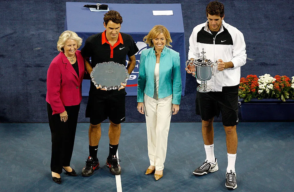 NEW YORK – SEPTEMBER 14:  (L-R) USTA president Lucy S. Garvin, Roger Federer of Switzerland and Juan Martin Del Potro of Argentina pose with the trophies after the Men’s Singles final on day fifteen of the 2009 U.S. Open at the USTA Billie Jean King National Tennis Center on September 14, 2009 in the Flushing neighborhood of the Queens borough of New York City. Del Potro defeated Federer 3-6, 7-6 (7), 4-6, 7-6 (7), 6-2.  (Photo by Jared Wickerham/Getty Images)