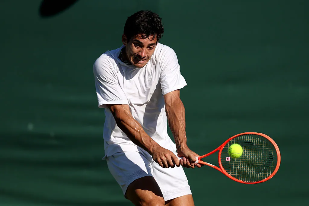 LONDON, ENGLAND – JUNE 30: Cristian Garin of Chile plays a backhand against Chris Rodesch of Luxembourg during the Gentlemen’s Singles first round match on day one of The Championships Wimbledon 2025 at All England Lawn Tennis and Croquet Club on June 30, 2025 in London, England. (Photo by Clive Brunskill/Getty Images)