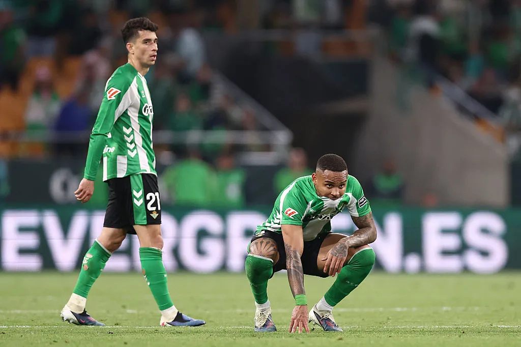 SEVILLE, SPAIN – MARCH 01: Natan and Marc Roca of Real Betis look dejected after conceding a second goal scored by Isaac Romero of Sevilla FC (not pictured) during the LaLiga EA Sports match between Real Betis Balompie and Sevilla FC at Estadio La Cartuja on March 01, 2026 in Seville, Spain. (Photo by Fran Santiago/Getty Images)