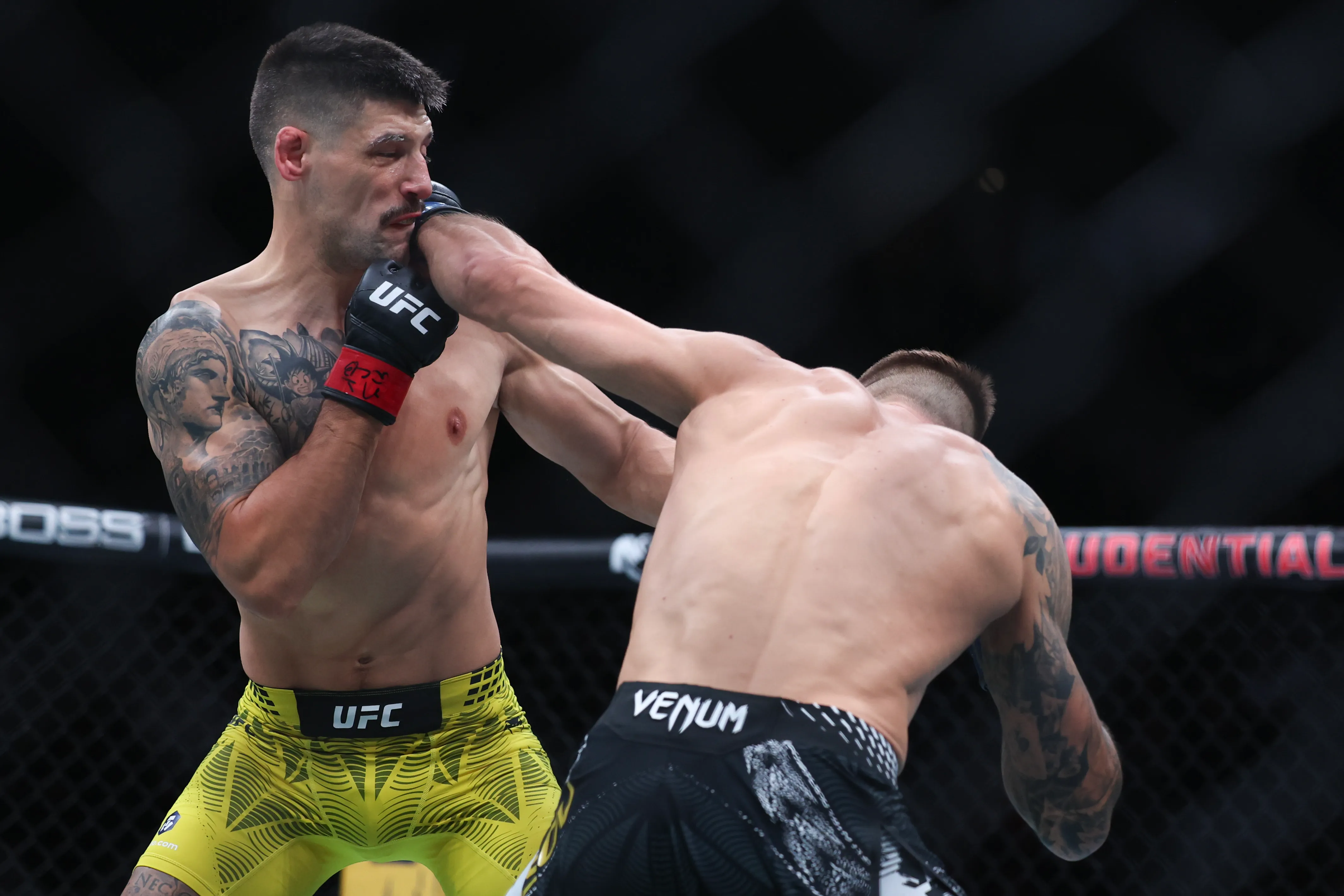 NEWARK, NEW JERSEY - MAY 09: Yaroslav Amosov of Ukraine, (R), strikes Joel Álvarez of Spain in a welterweight fight during UFC 328 at the Prudential Center on May 09, 2026 in Newark, New Jersey. (Photo by Ishika Samant/Getty Images)