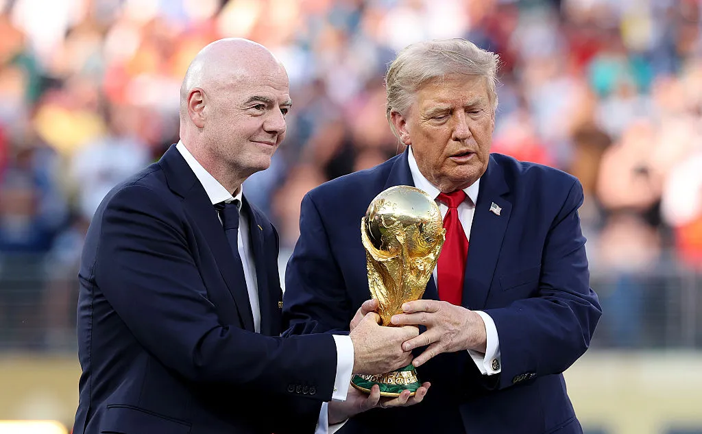 EAST RUTHERFORD, NEW JERSEY – JULY 19: U.S. President Donald Trump and FIFA President Gianni Infantino hold the FIFA World Cup Winner’s Trophy before handing over to captain Rodri #16 of Spain at the award ceremony following the FIFA World Cup 2026 Final match between Spain and Argentina at New York New Jersey Stadium on July 19, 2026 in East Rutherford, New Jersey. (Photo by Carl Recine/Getty Images)