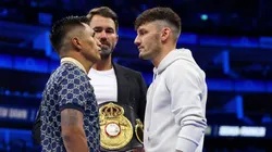 LONDON, ENGLAND - APRIL 01: Mauricio Lara (L) and Leigh Woods (R) face off alongside promoter, Eddie Hearn (C) for their upcoming fight at The O2 Arena on April 01, 2023 in London, England. (Photo by James Chance/Getty Images)