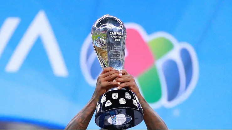 MEXICO CITY, MEXICO - DECEMBER 29: Dorlan Pabon #8 of Monterrey celebrates with the champions trophy after the Final second leg match between America and Monterrey as part of the Torneo Apertura 2019 Liga MX at Azteca Stadium on December 29, 2019 in Mexico City, Mexico. (Photo by Hector Vivas/Getty Images)