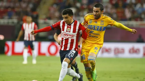 ZAPOPAN, MEXICO – SEPTEMBER 13: Fernando Beltran of Chivas fights for the ball with Juan Vigon of Tigres during the 9th round match between Chivas and Tigres UANL as part of the Torneo Apertura 2022 Liga MX at Akron Stadium on September 13, 2022 in Zapopan, Mexico. (Photo by Refugio Ruiz/Getty Images)