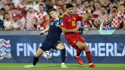 Perisic y Asensio luchan por la pelota en el último enfrentamiento.