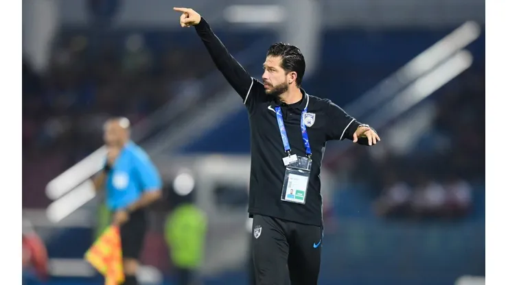 Assistant head Coach Benjamin Mora of Malaysia s Johor Darul Ta zim F C shouts instructions to his