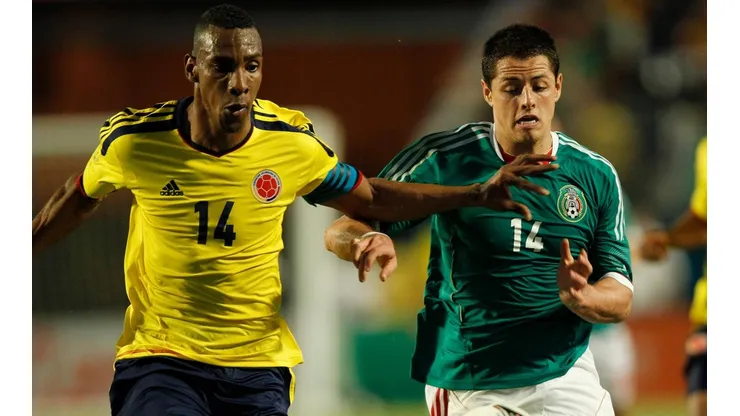 Luis Amaranto Perea y Javier Hernández, algunos de los protagonistas del último México vs. Colombia.