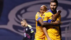 Luis Quiñones y André-Pierre Gignac.