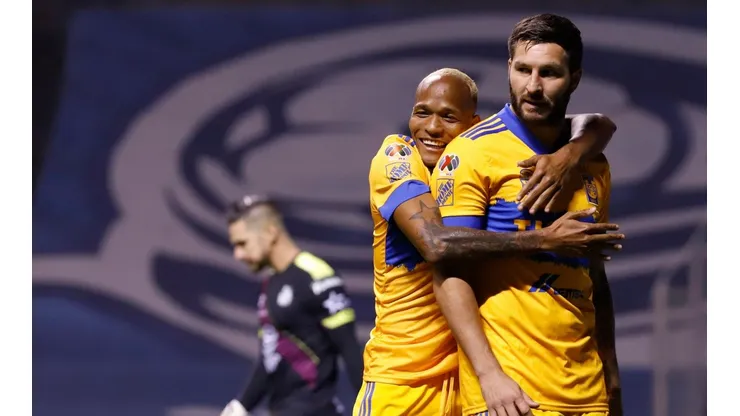 Luis Quiñones y André-Pierre Gignac.