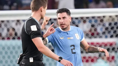 (221202) — AL WAKRAH, Dec. 2, 2022 — Jose Maria Gimenez (R) of Uruguay argues with referee Daniel Siebert after the Gr