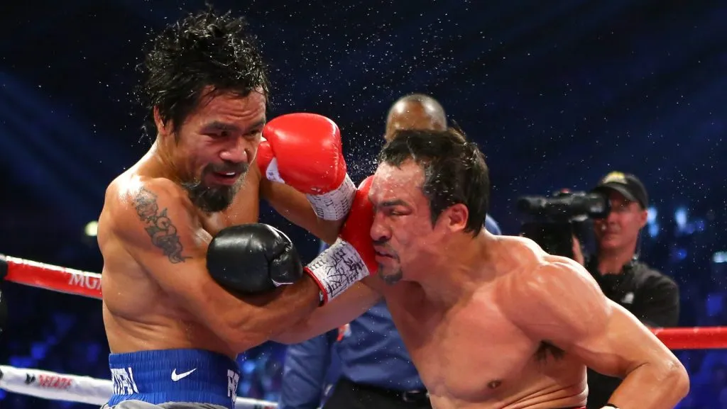 Manny Pacquiao y Juan Manuel Márquez se enfrentaron cuatro veces, protagonizando una de las rivalidades más grandes en el deporte. (GETTY IMAGES)